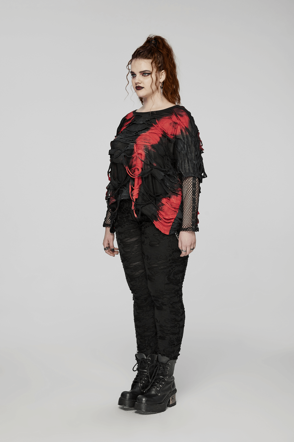 Edgy punk tie-dye loose top with mesh sleeves, featuring black and red shredded fabric for a bold rebel look.