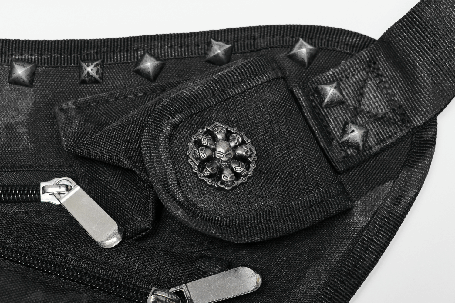 Close-up of edgy punk waist bag featuring rivets, zippers, and an artistic pocket design for a rebellious look.