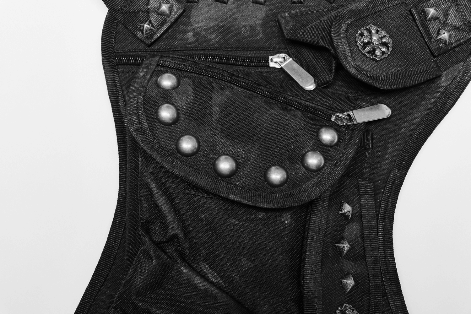 Edgy punk waist bag featuring multifunctional pockets, rivets, and an irregular shape in black fabric.