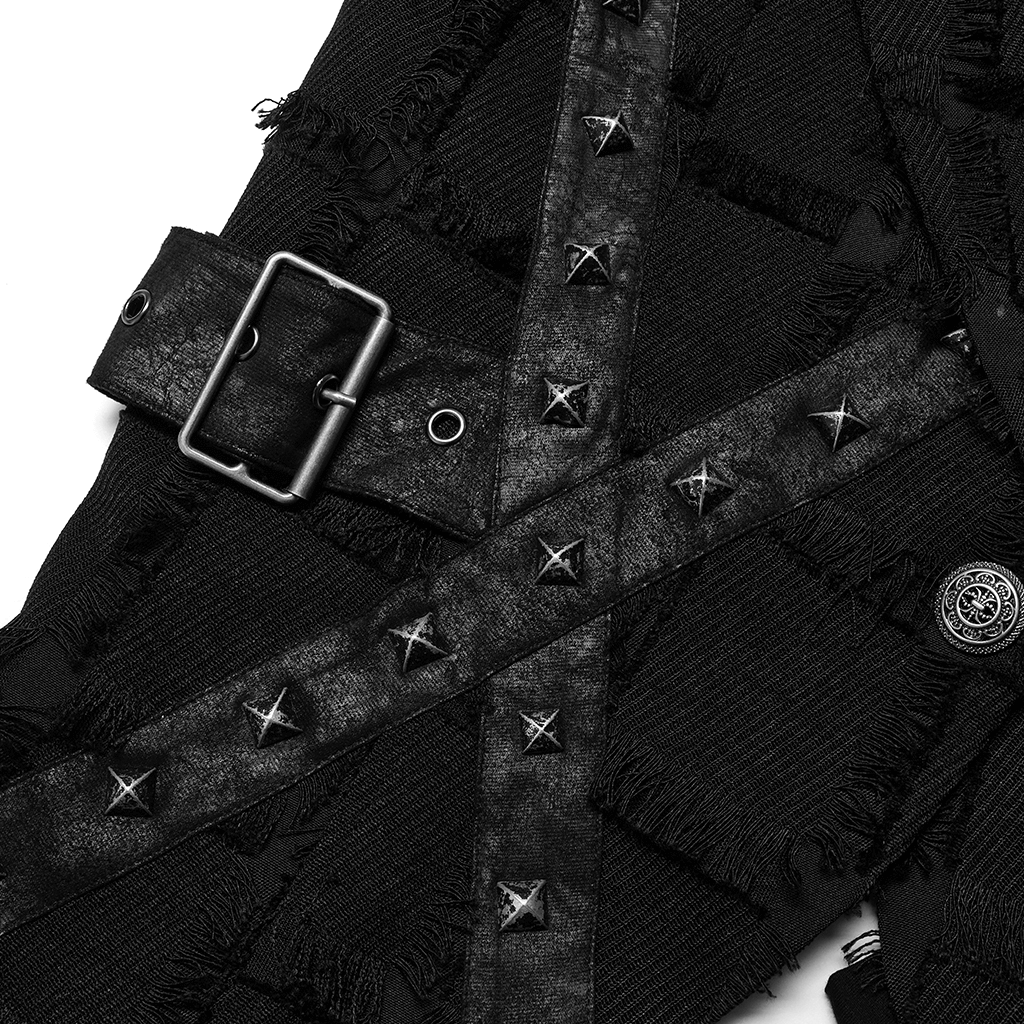 Close-up of black punk vest with buckle and star-studded detailing, showcasing edgy gothic fashion.