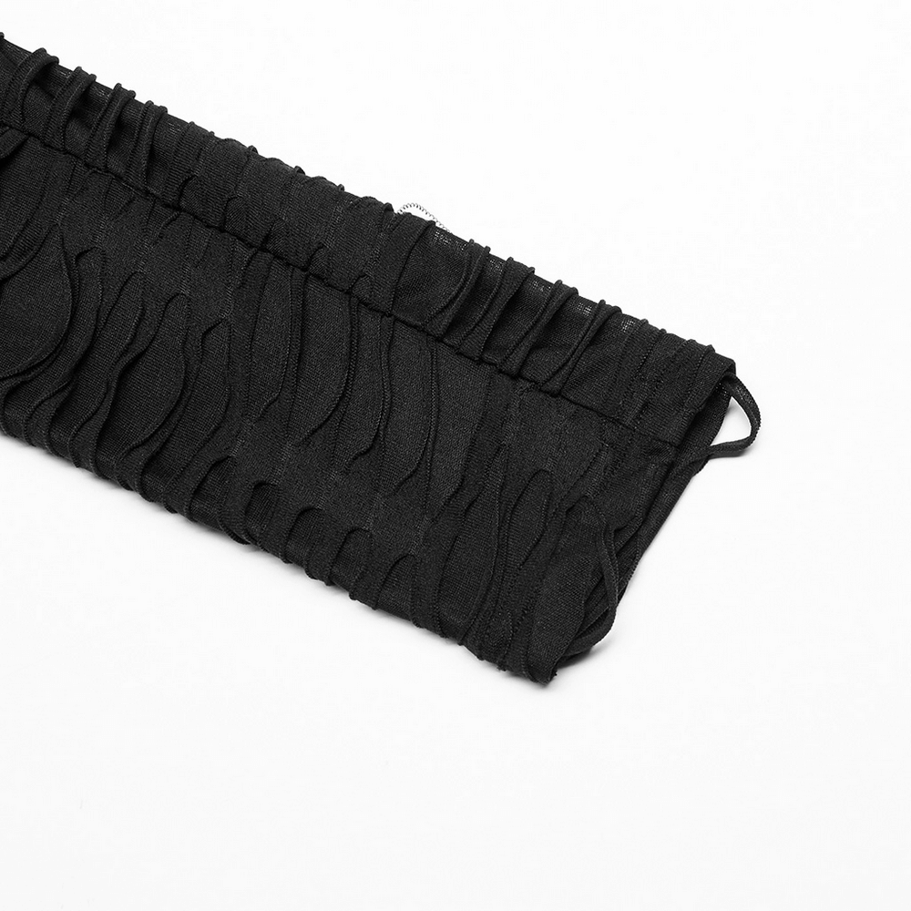 Edgy black leggings featuring stylish ripped design and metal rivets, perfect for goth-inspired fashion.