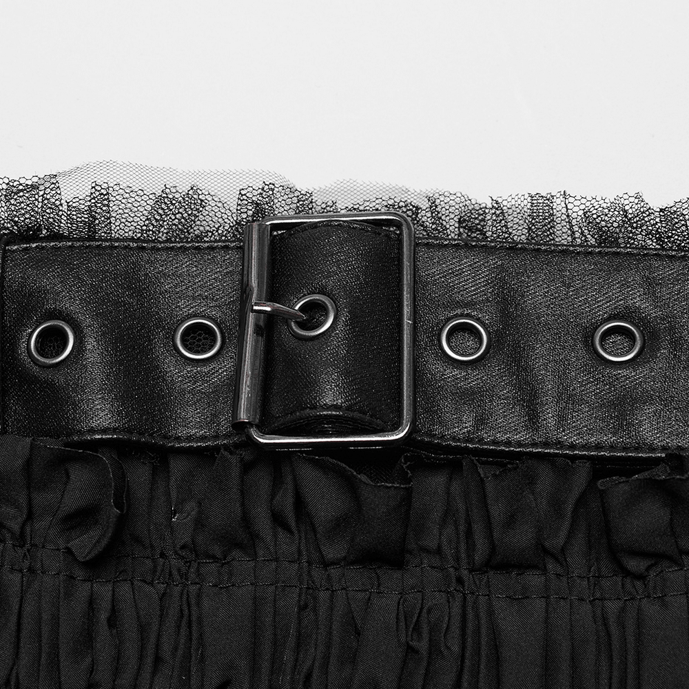 Close-up of black ruffled mesh tube top with leather accents and buckle detail.