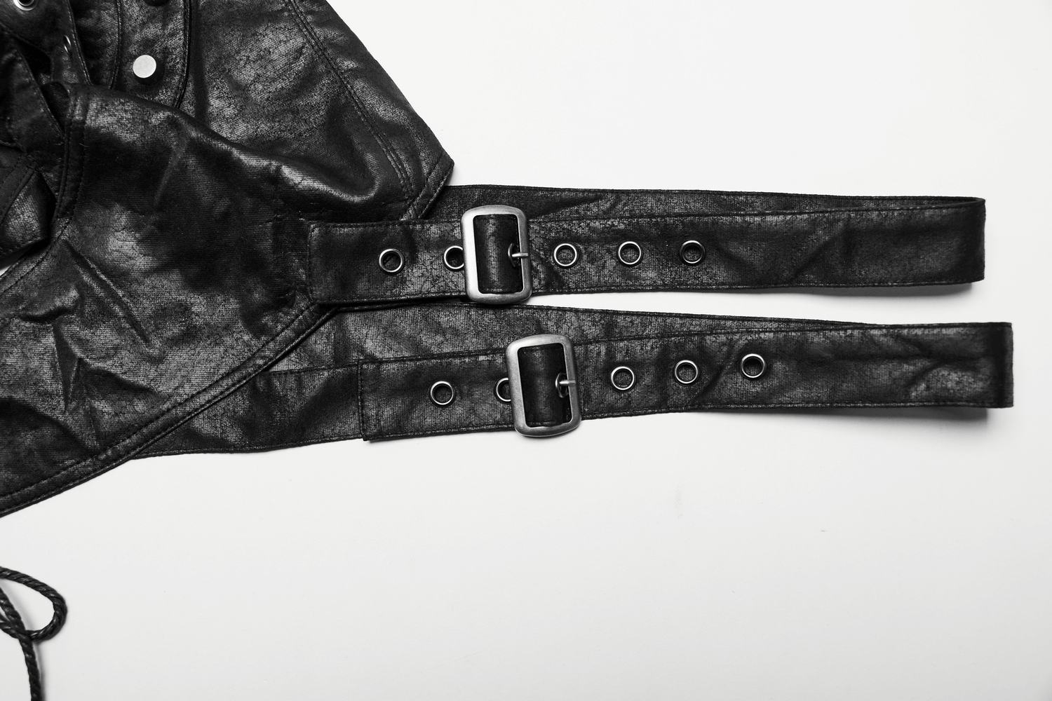 Close-up of adjustable black shoulder armor straps with buckles, perfect for gothic and punk fashion.