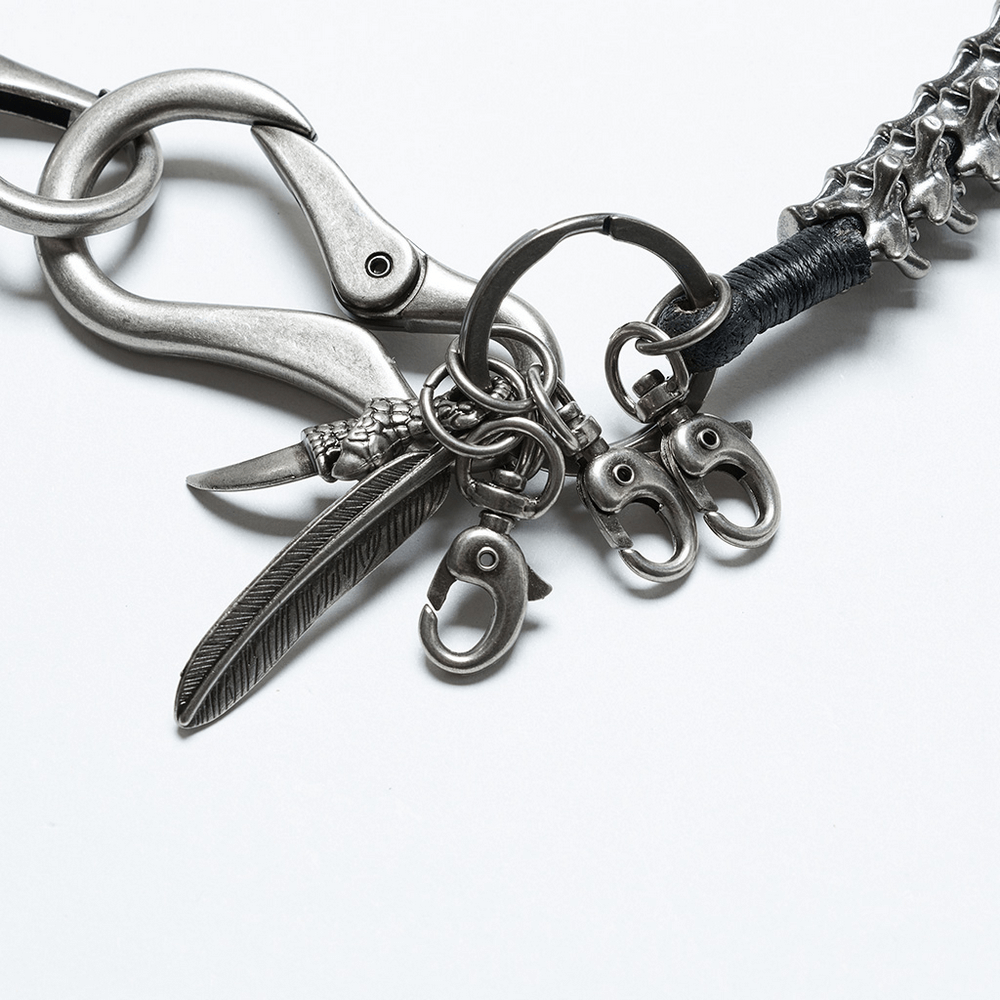 Edgy skeleton waist chain with skull, feather charms, and lobster clasps, featuring a simulated spine design for a bold punk aesthetic.