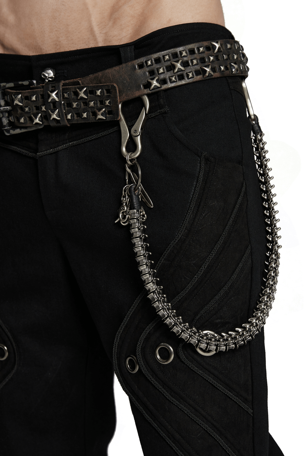 Edgy skeleton waist chain with lobster clasps and skull charms on black jeans, featuring a punk-inspired design with a retro aesthetic.