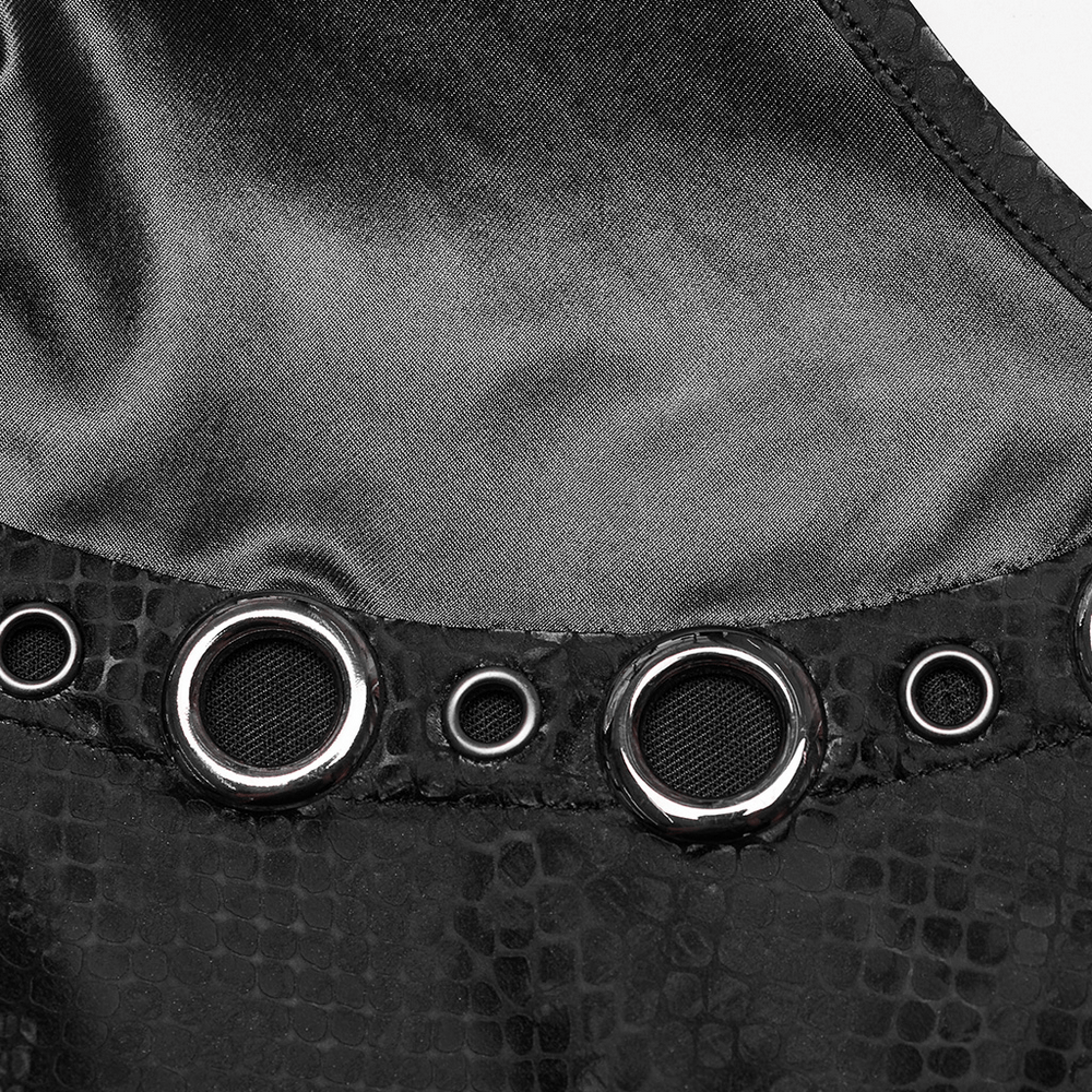 Close-up of edgy snake-skin patterned dress showing metal eyelet detail and sleek finish.