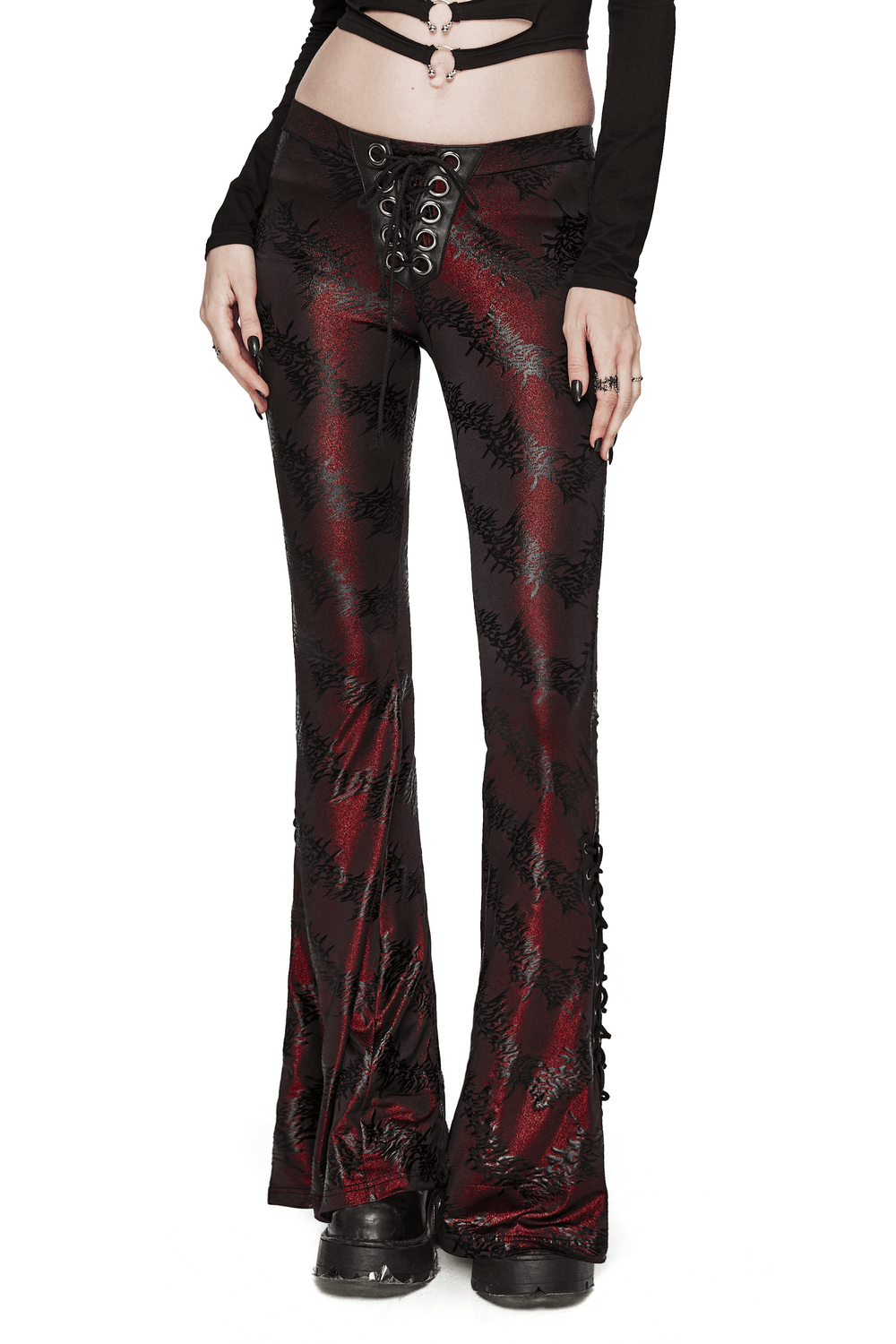 Edgy sparkly flared pants with lace-up detail for women, featuring a dramatic silhouette and playful drawstring.