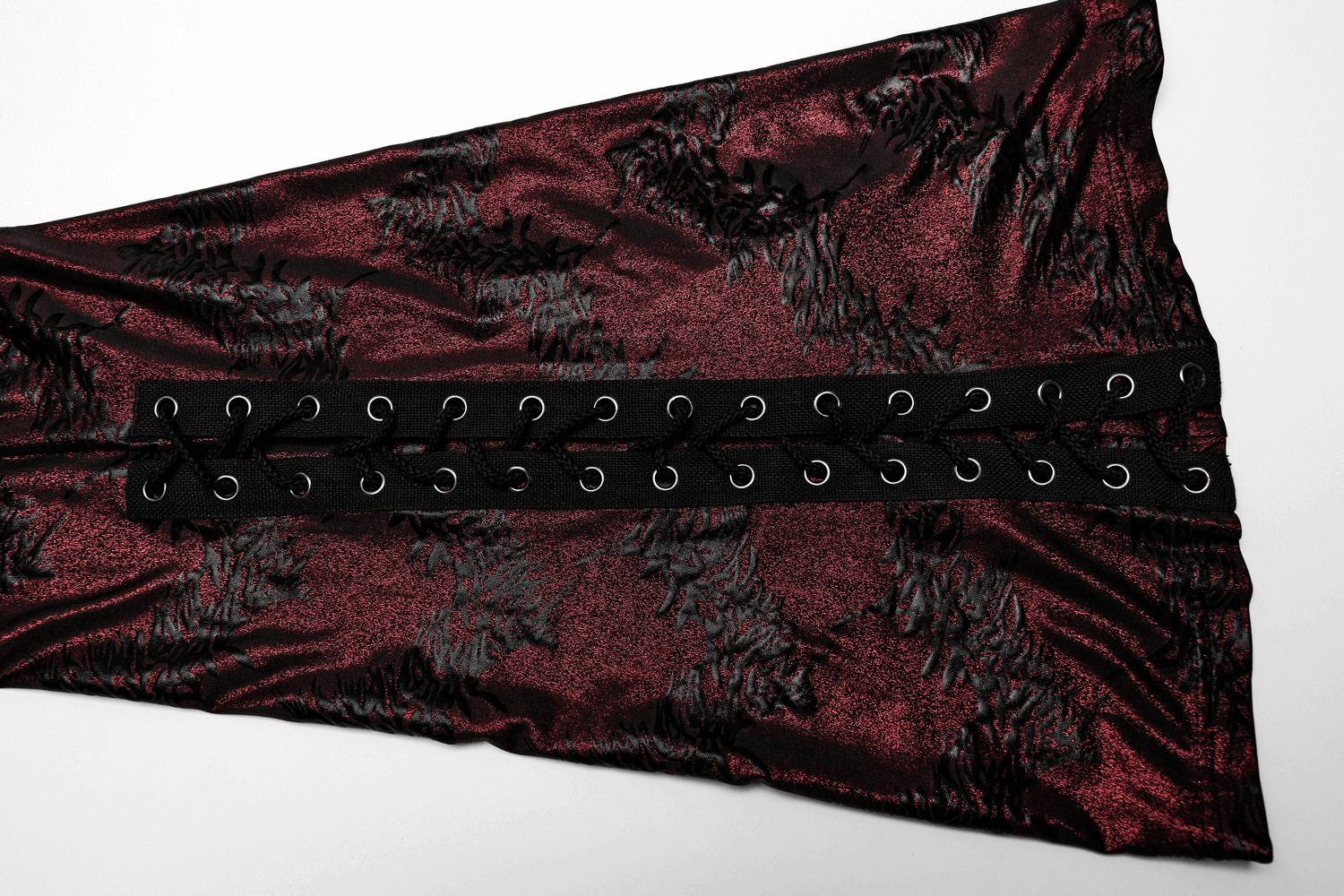 Edgy sparkly flared pants with lace-up detail in a rich burgundy fabric, perfect for a dramatic outfit.