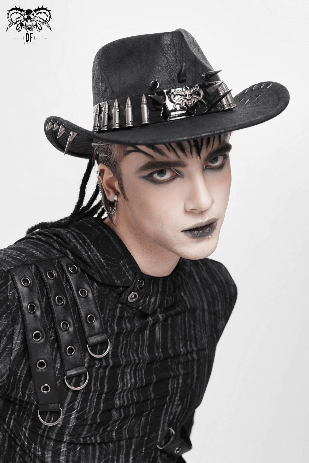 Edgy Spiked Bullet Trim Gothic Western Cowboy Hat worn by a model with dramatic makeup and stylish attire.