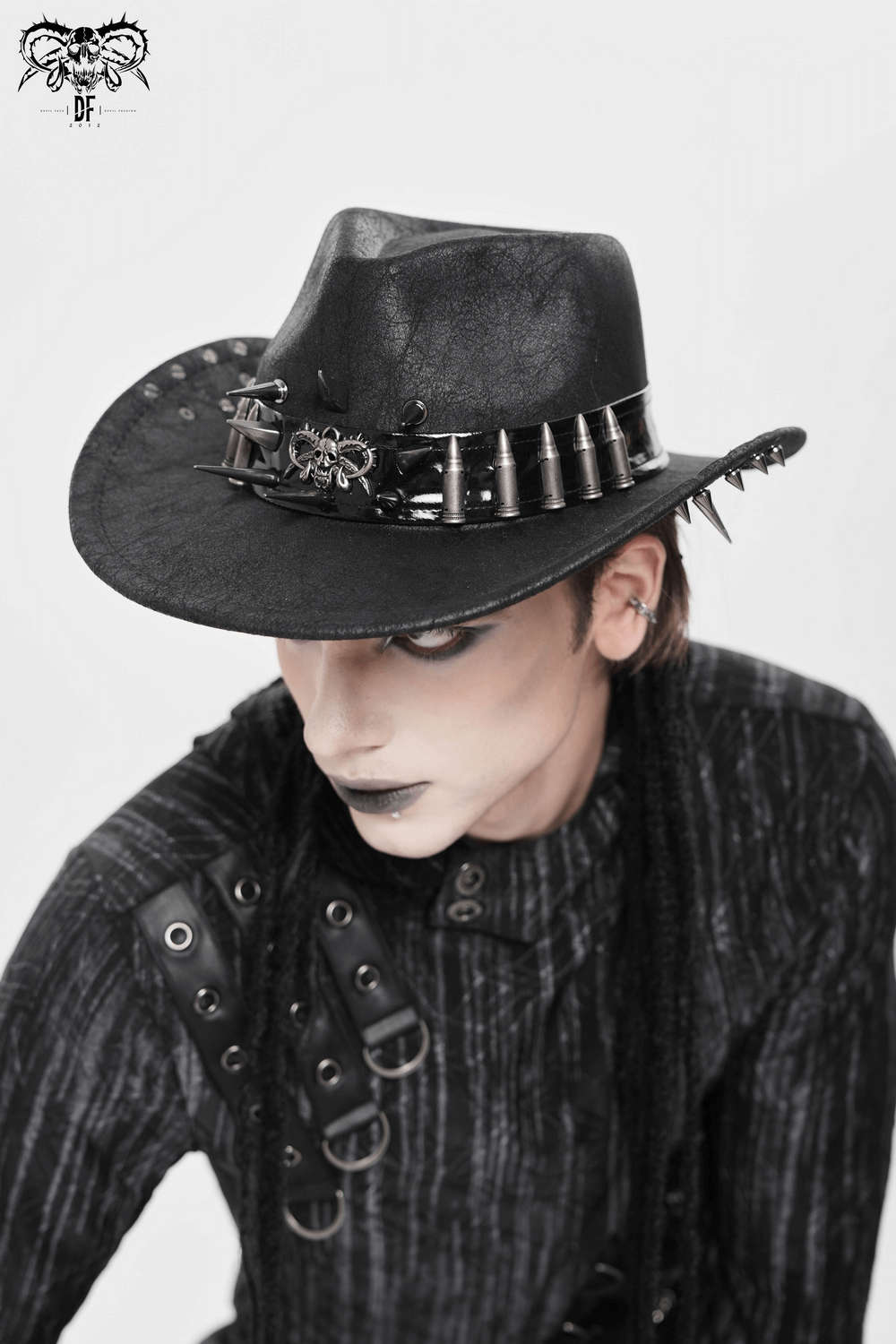Edgy Spiked Bullet Trim Gothic Western Cowboy Hat worn by a model with dark makeup and attire.