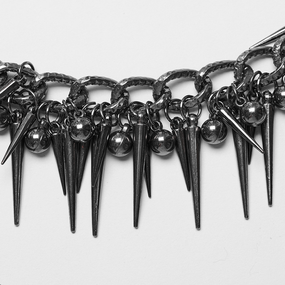 Edgy metal waist chain with rivet details featuring spikes and spherical embellishments, perfect for a punk look.