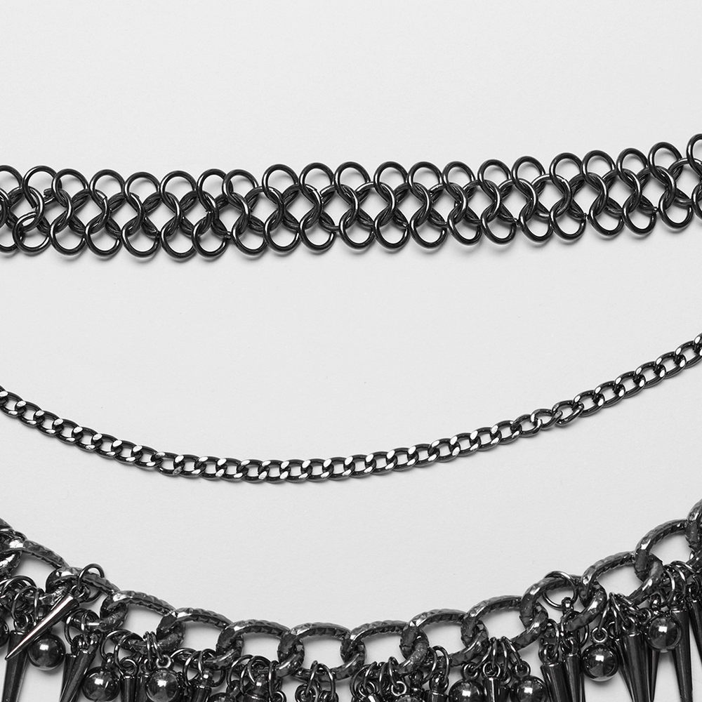 Close-up of an edgy metal waist chain featuring intricate rivet details and a unique design.