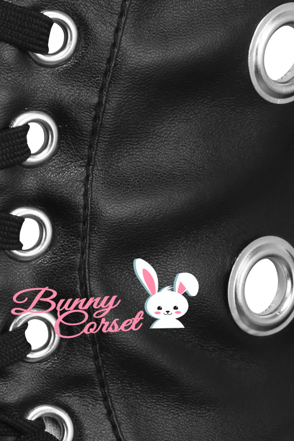 Close-up of black faux leather corset belt with lacing and metal grommets, designed for a stylish silhouette.