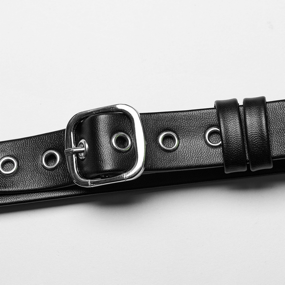 Close-up of a black PU leather belt with silver buckle and grommets, showcasing edgy punk style.