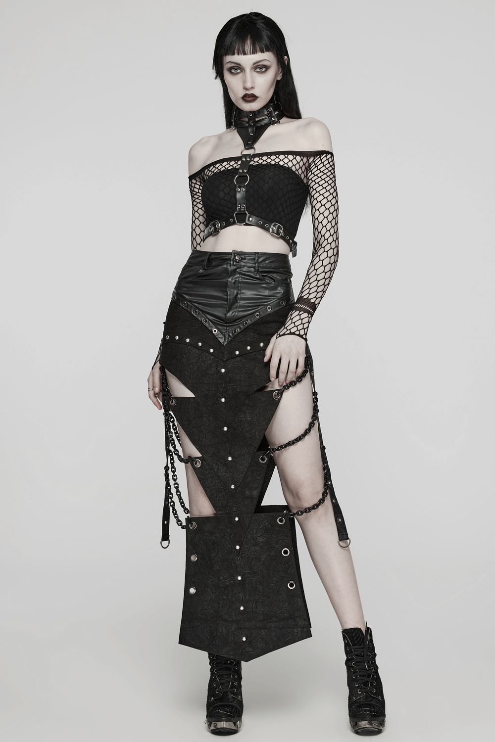 Edgy women's punk fashion featuring a PU leather body harness, choker, and stylish layered outfit with chains.