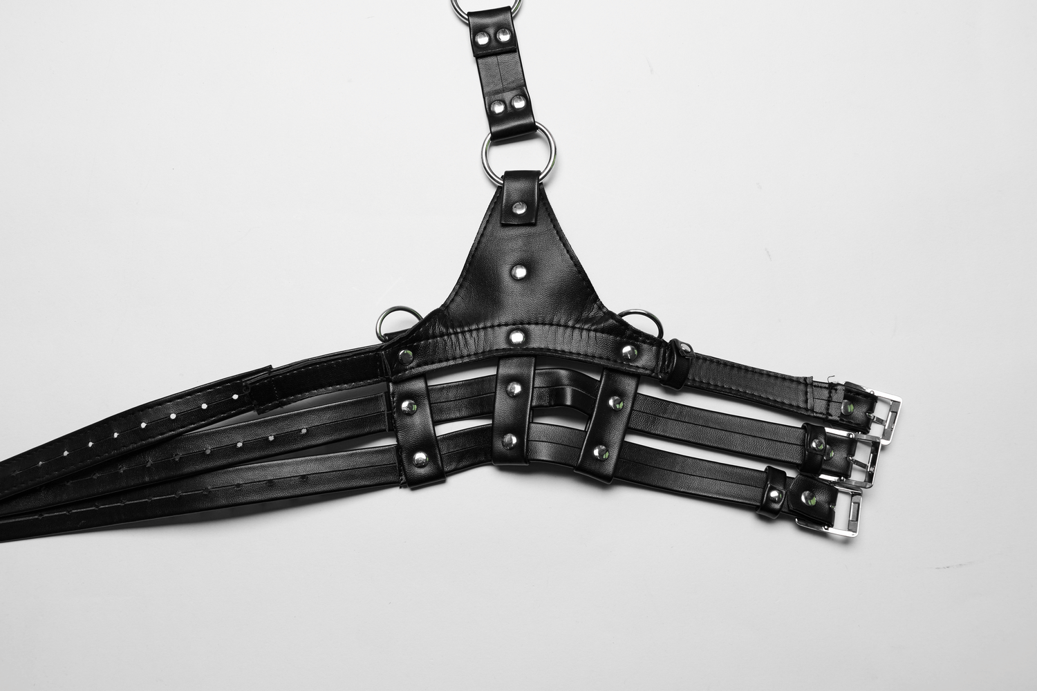 Edgy PU leather body harness with adjustable straps and bold design, perfect for adding punk style to any outfit.