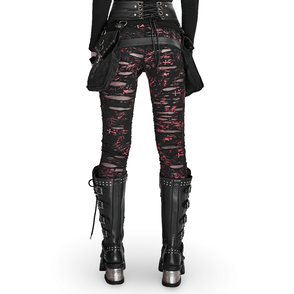Back view of edgy women's shredded black-red punk rock leggings with lace-up detailing and studded black boots.