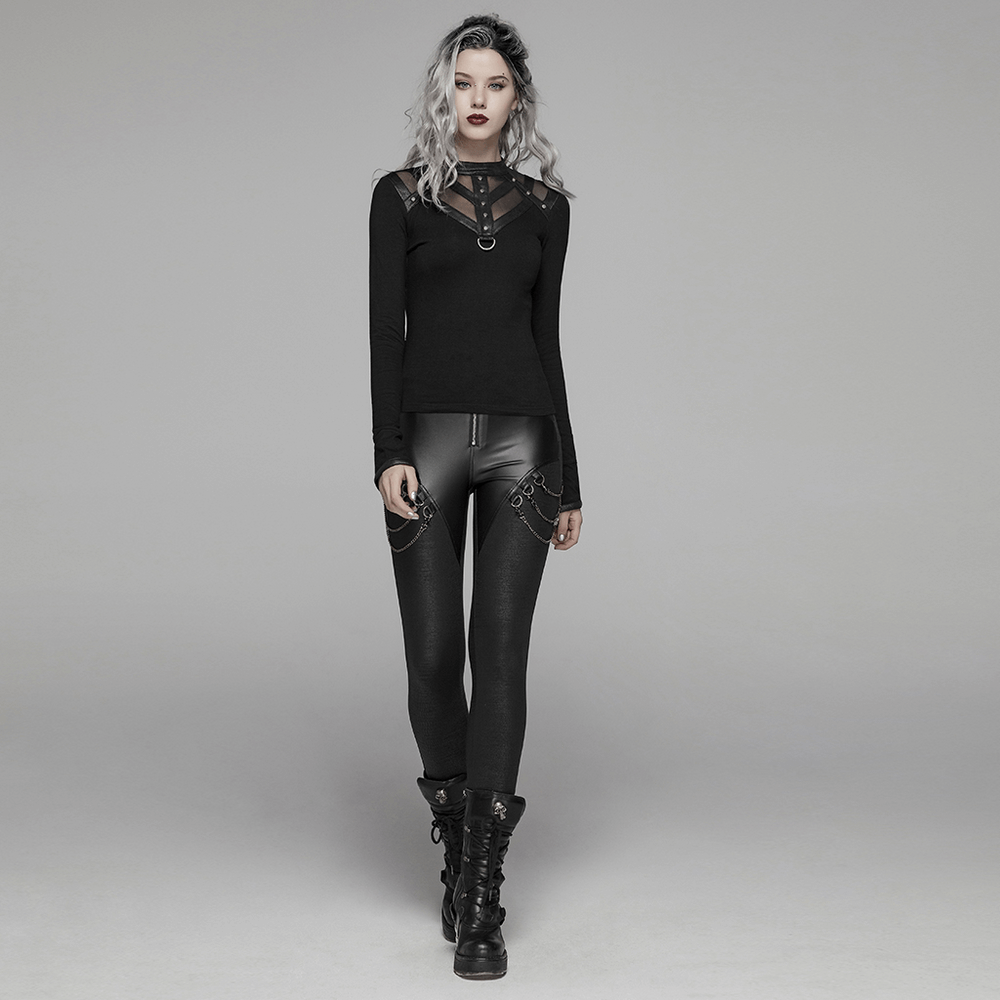 Model wearing black punk rock leggings with crackle PU leather and chain detail, styled with a black long-sleeve top.