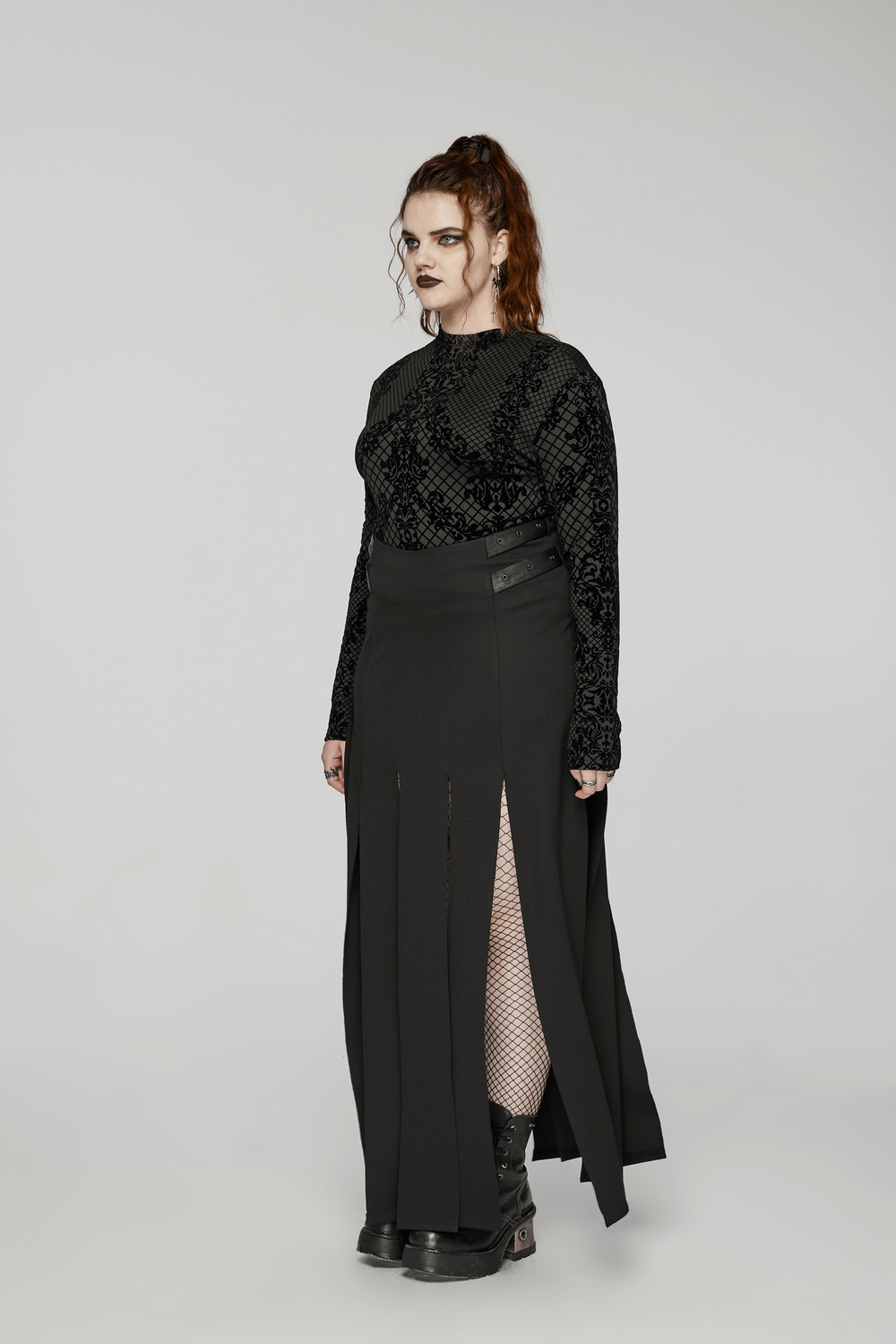 Gothic style model wearing an elastic knit flocking top with high collar and a slit skirt, showcasing dark fashion.