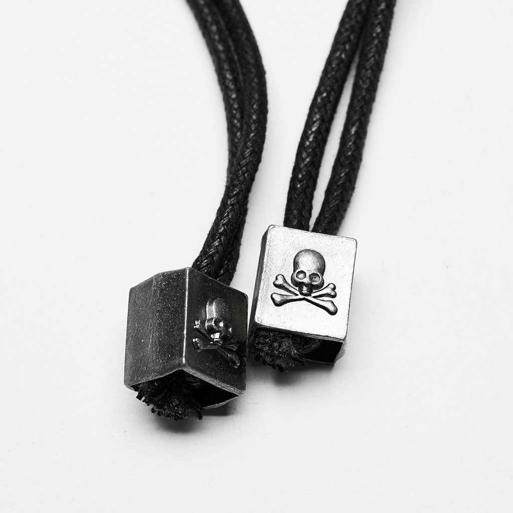 Skull and crossbones detail on black cord necklace with metal embellishments for punk style.