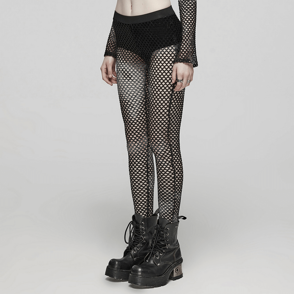 Stylish women's black fishnet leggings with punk rock vibe, perfect for edgy outfit combinations.