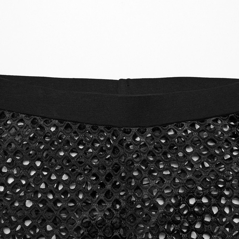 Close-up of the waistband and black fishnet design of punk rock leggings for women.