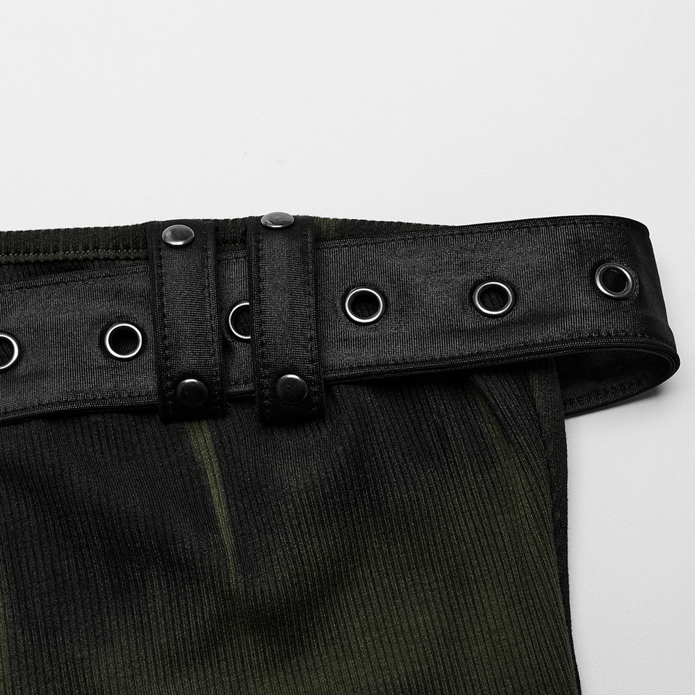 Close-up of black ribbed belt with grommets, adding edgy style to the dress's design.