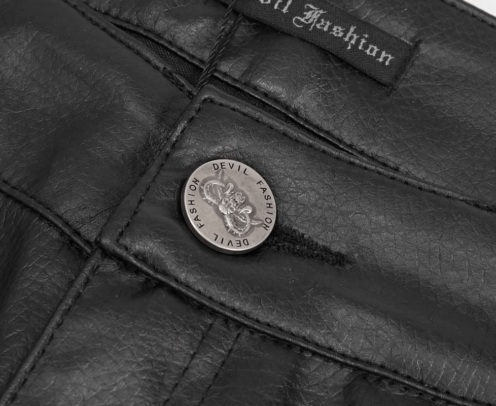 Close-up of black PU leather pants button with 'Devil Fashion' logo, showcasing punk style detail.