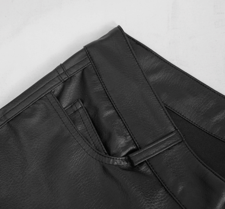 Close-up of black PU leather pants showing stylish stitching and pockets for a punk-inspired look.