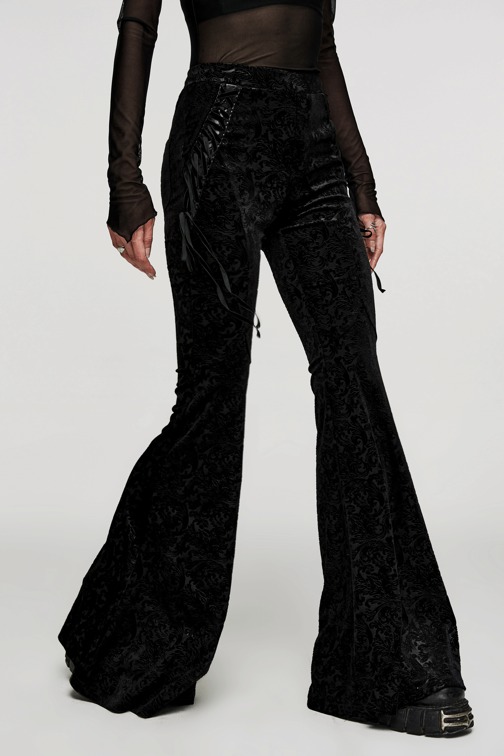 Elastic velvet gothic flare pants with side lacing, featuring a snug fit and dark jacquard texture, ideal for dark fashion.