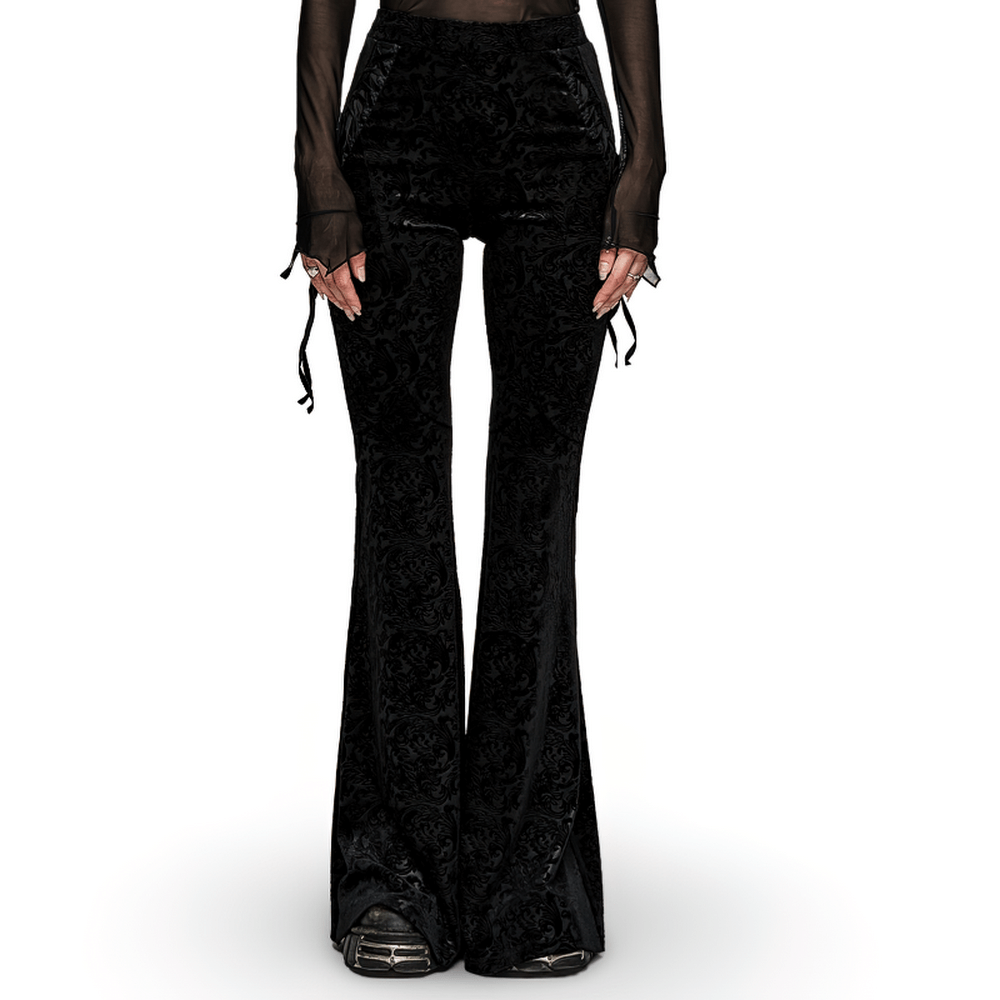 Gothic flare pants in black velvet with side lacing, showcasing stretchy embossed fabric for a snug, stylish fit.