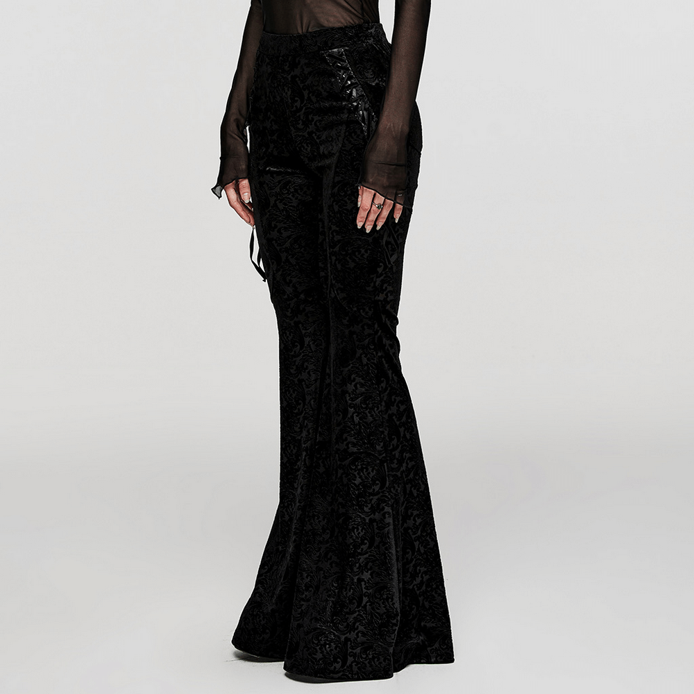 Gothic flare pants in black embossed velvet featuring side lacing for adjustable fit and stylish dark allure.
