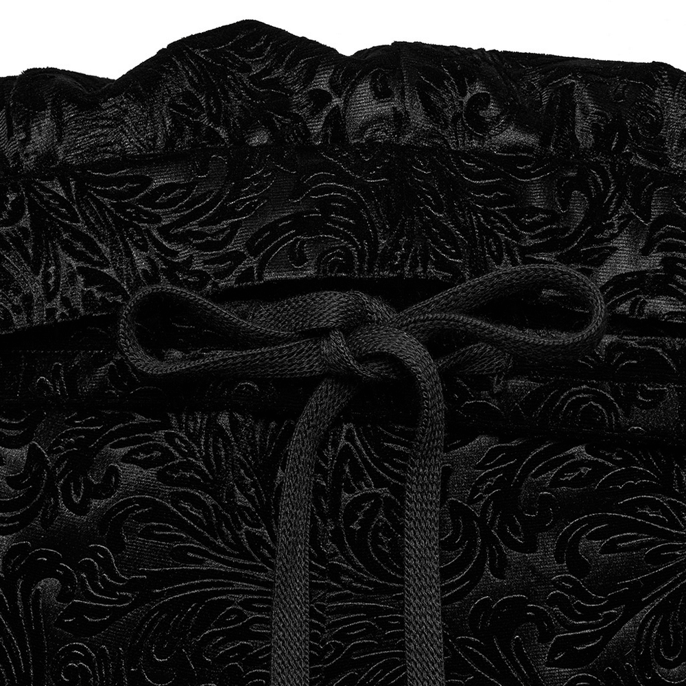 Close-up of elastic velvet lace-up detail on Gothic flare pants, showcasing intricate dark texture and adjustable fit.