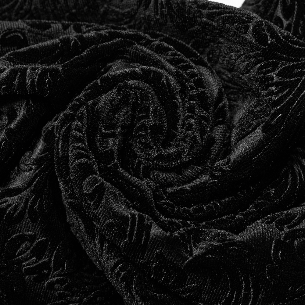 Close-up of luxurious black embossed velvet fabric, perfect for gothic flare pants with dark allure.