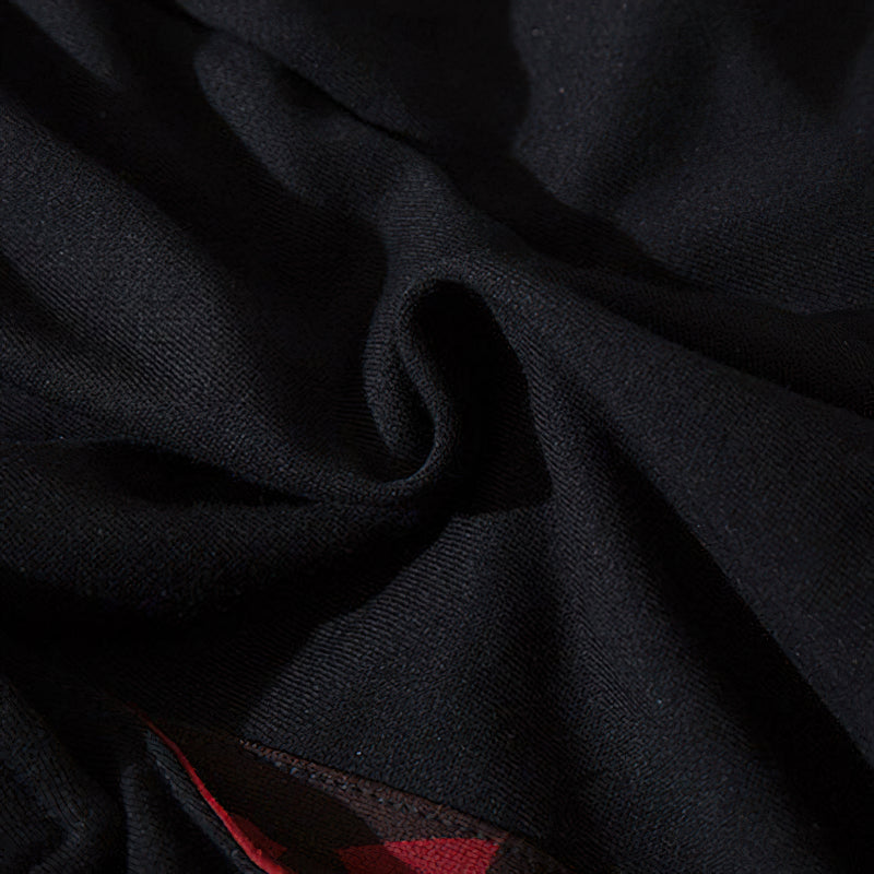 Close-up of soft black fabric from elastic waist men's joggers, showcasing comfort and flexibility.