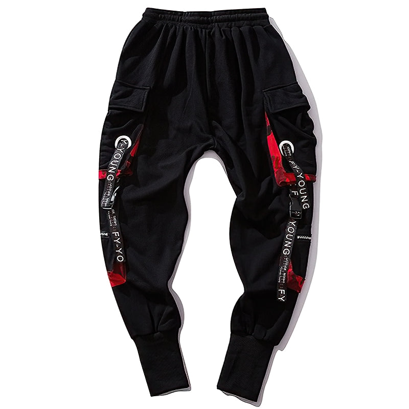 Stylish black joggers with elastic waist and multiple pockets, featuring trendy straps and buckles for streetwear fashion.