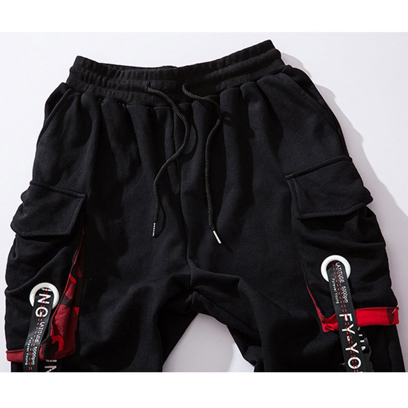 Men's elastic waist joggers with multi pockets and stylish buckle straps, perfect for casual streetwear.