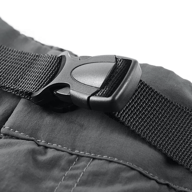 Close-up of clip buckle on elastic waist tactical shorts showcasing durable design and quality craftsmanship.