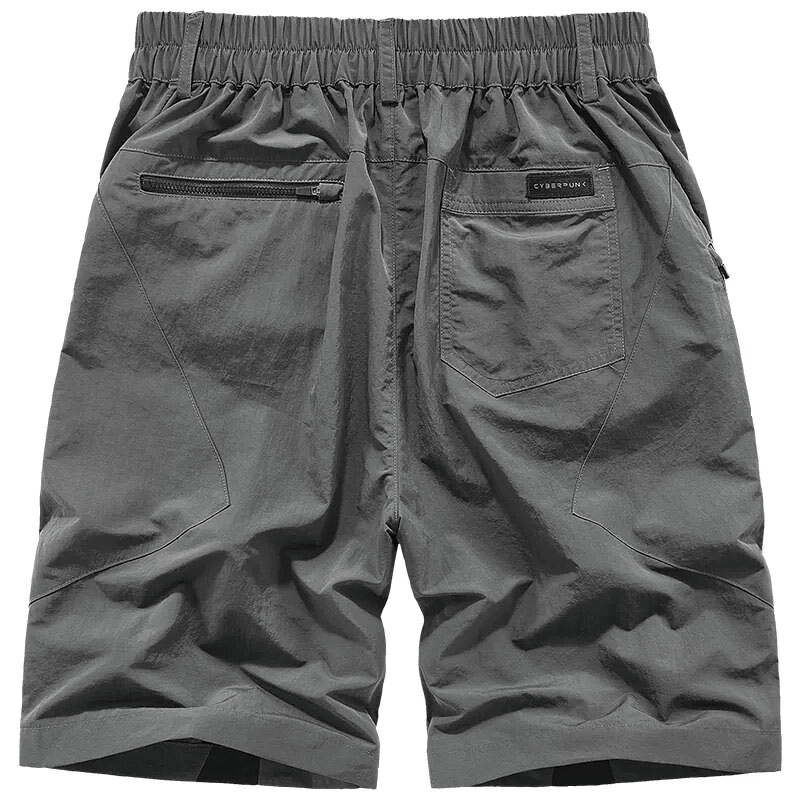 Men's elastic waist tactical shorts in gray with stylish zippered pockets for practicality and comfort.