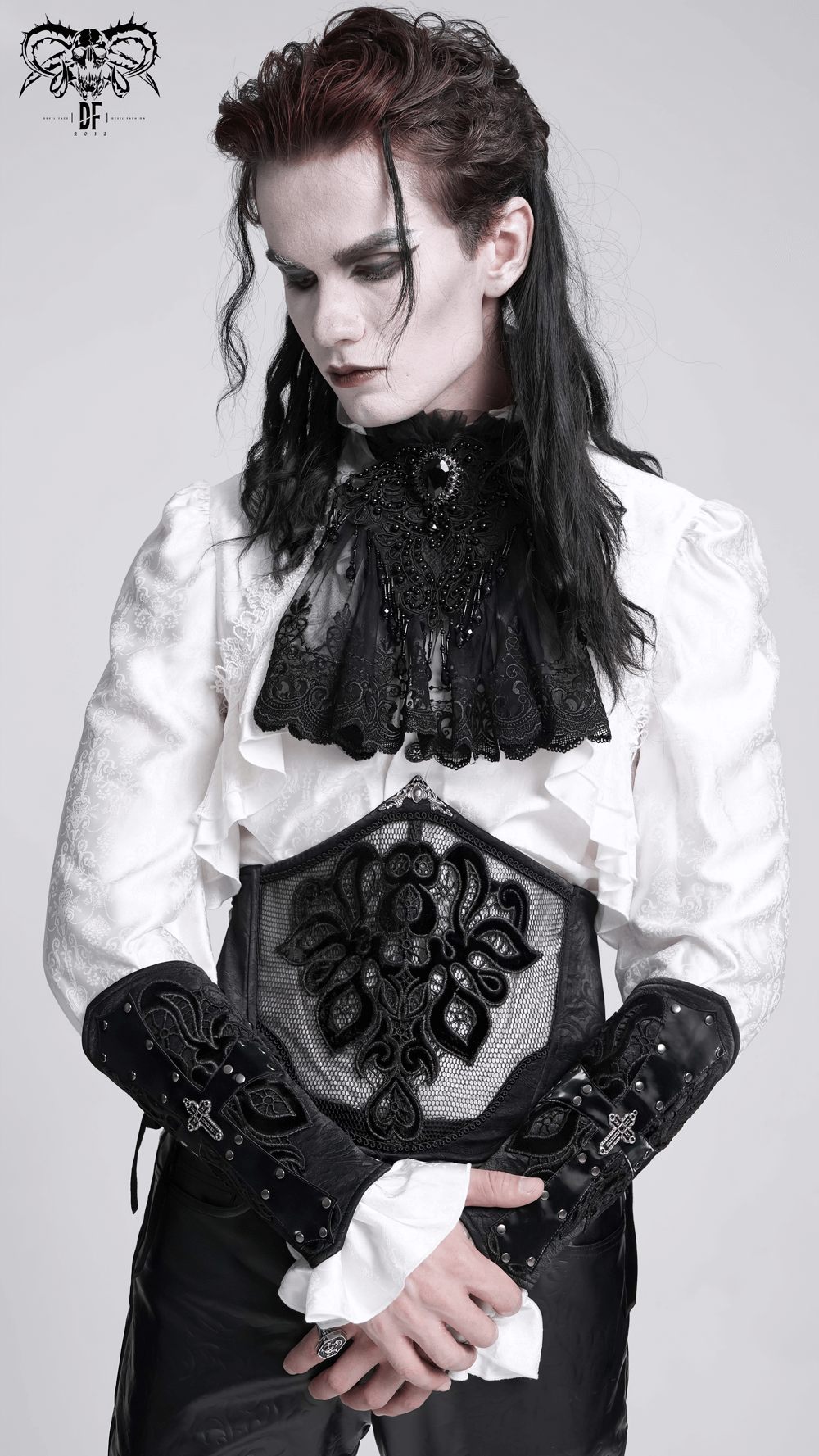 Elegant gothic outfit showcasing intricate black lace and bold details, perfect for alternative fashion enthusiasts.