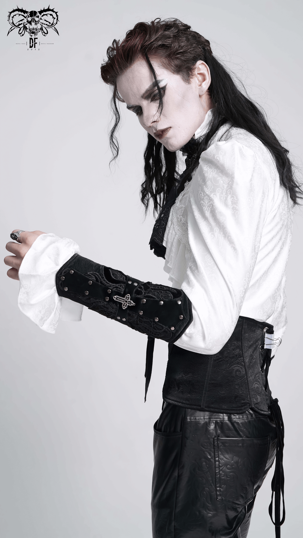 Model showcasing an elegant adjustable gothic bracelet with lace details, styled with a bold white shirt and dark attire.