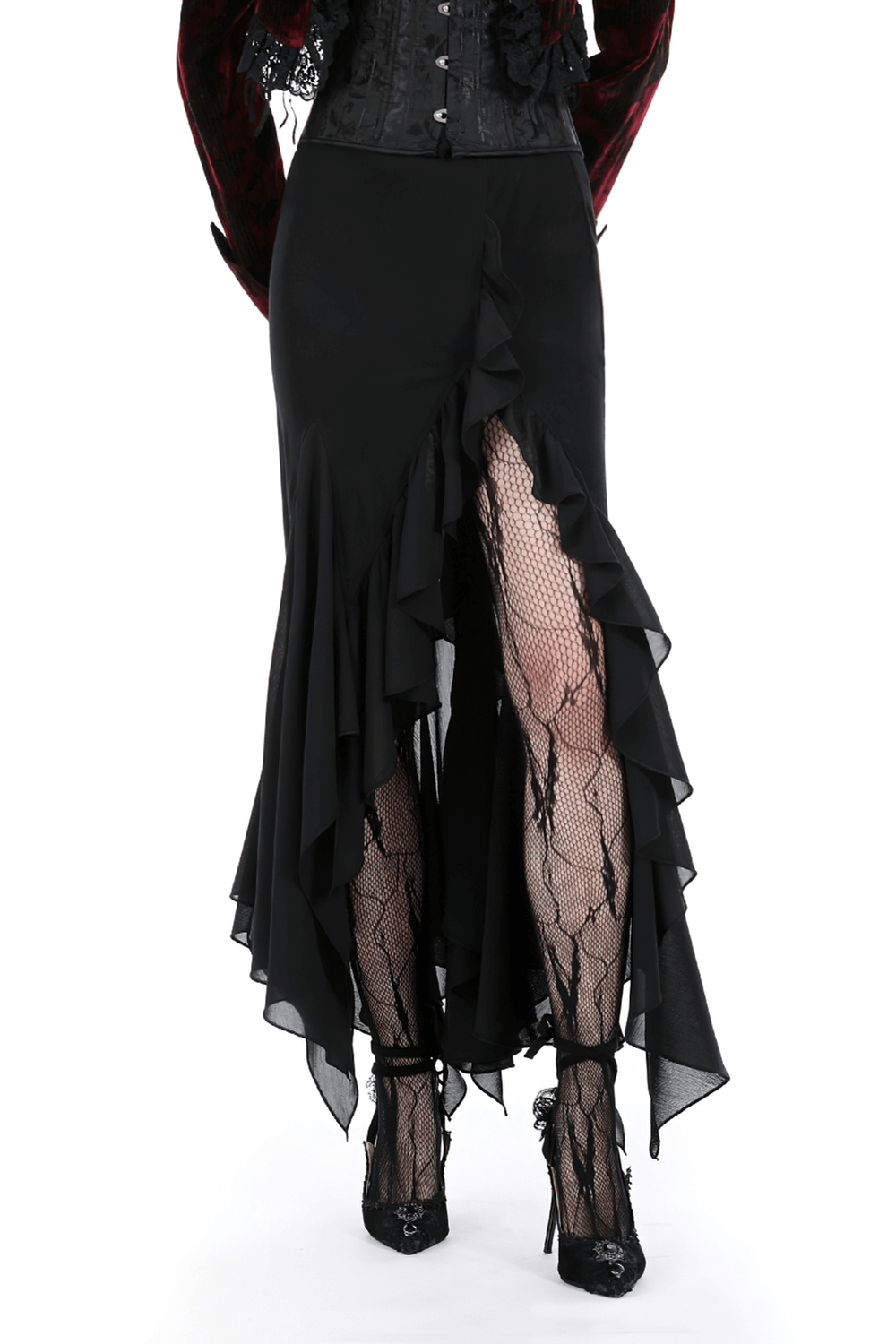 Elegant asymmetrical black long skirt with ruffles and slit, paired with fishnet stockings and stylish heels.