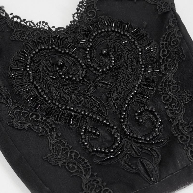 Close-up of intricate black guipure detail on a gothic floral bucket bag for women.