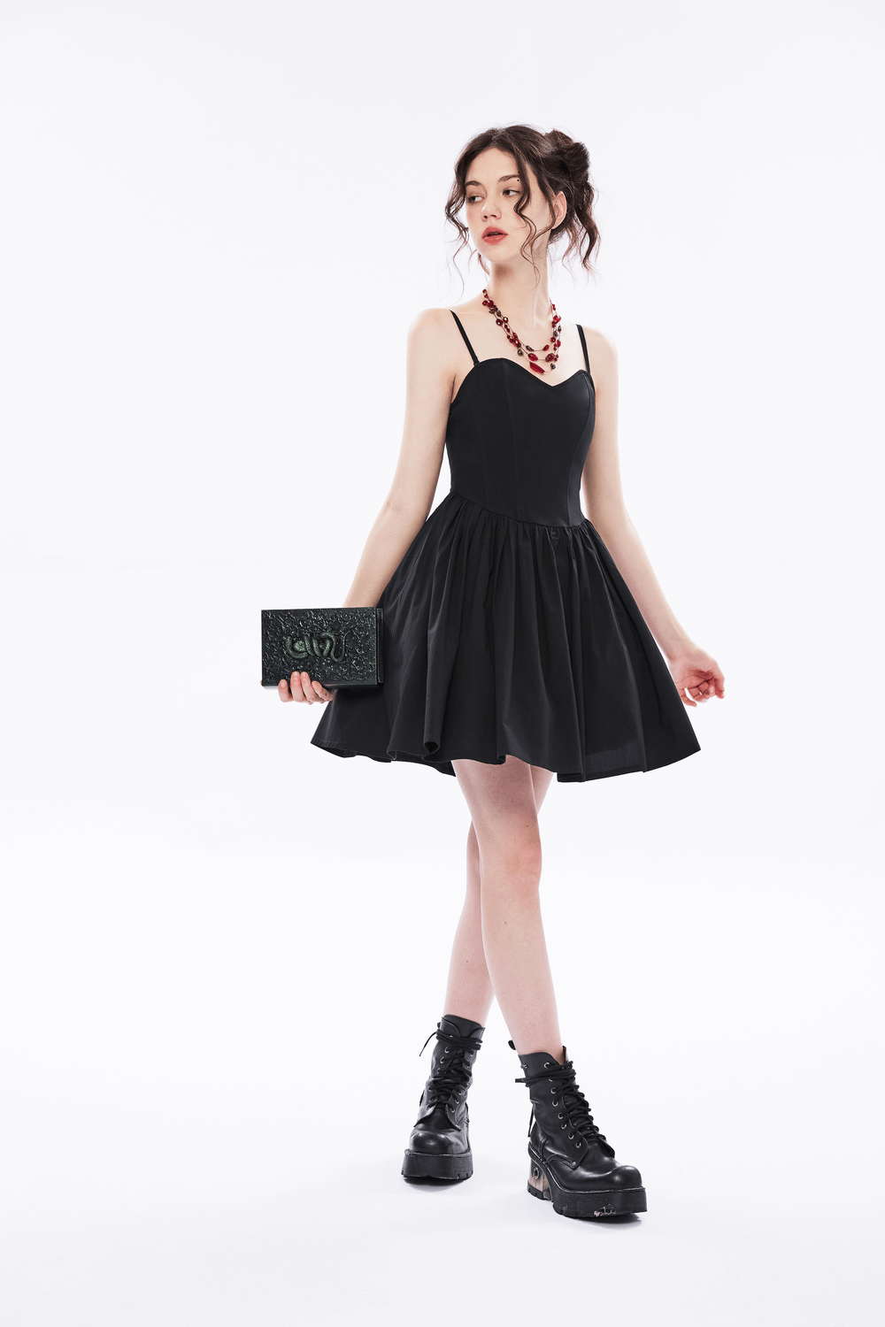 Chic black A-line skater dress with plaid interior, pleated skirt, and adjustable straps for a stylish fit.