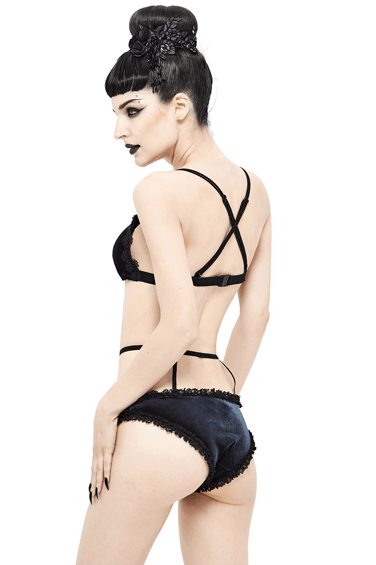 Elegant black and red bikini with lace inserts, showcasing a gothic style and flattering cut for women's swimwear.