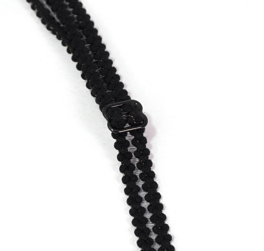 Close-up of the black lace strap detail on an elegant bikini, showcasing intricate design and fashion-forward style.