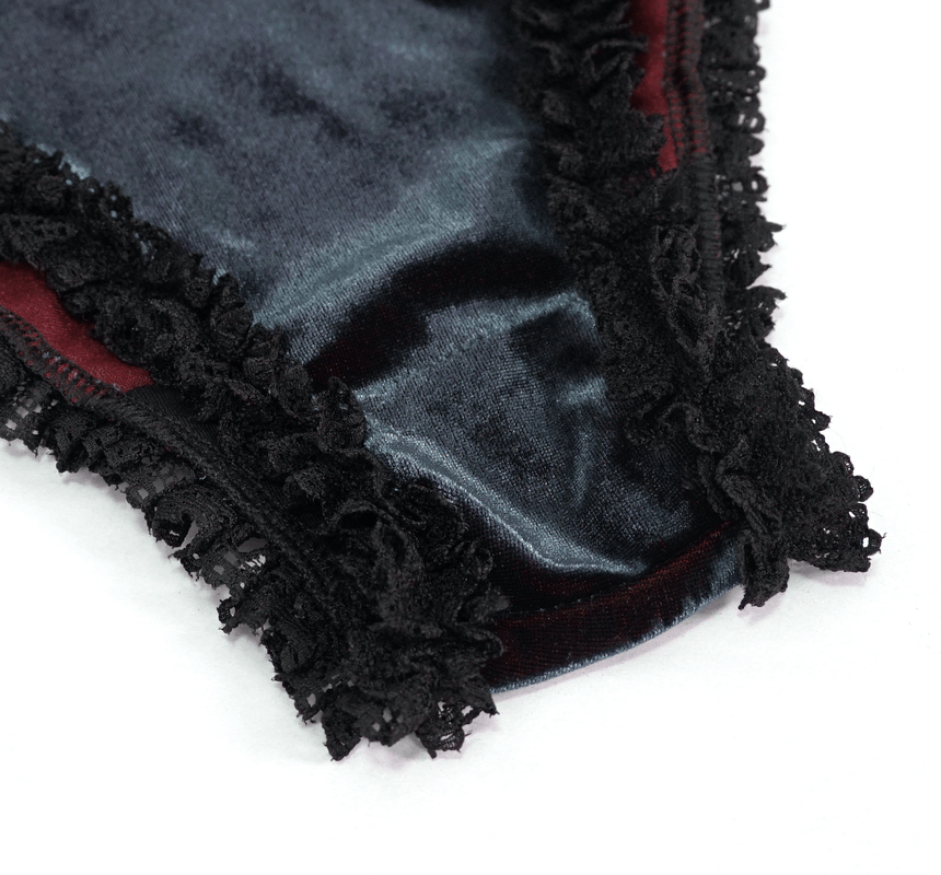Close-up of elegant black bikini with lace inserts, showing rich fabric and intricate detailing for a gothic sexy look.