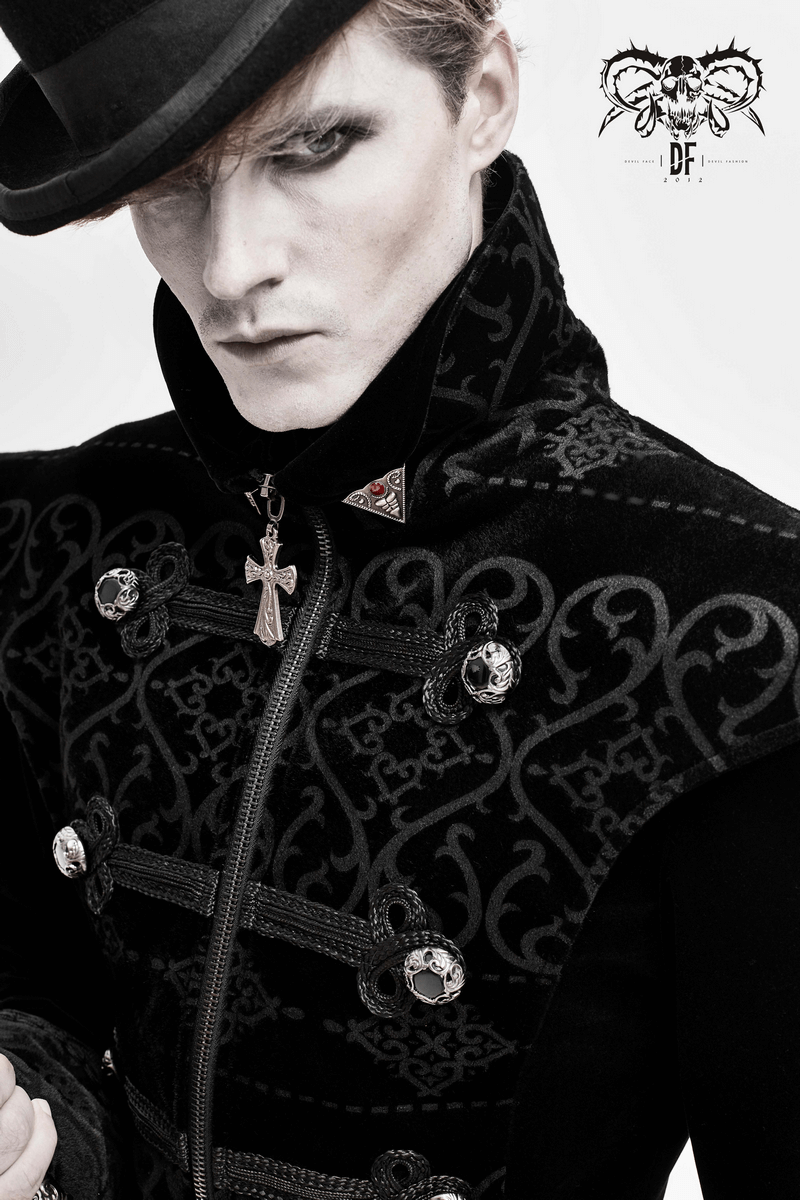 Elegant black coat with pointed shoulders, gothic details, and silver buttons on a stylish model.