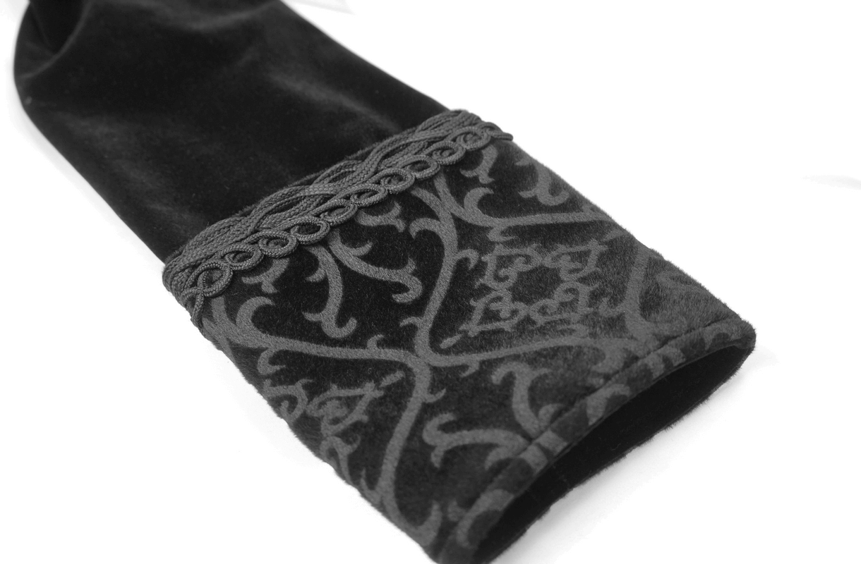 Close-up of elegant black coat sleeve featuring gothic pattern and intricate detailing.