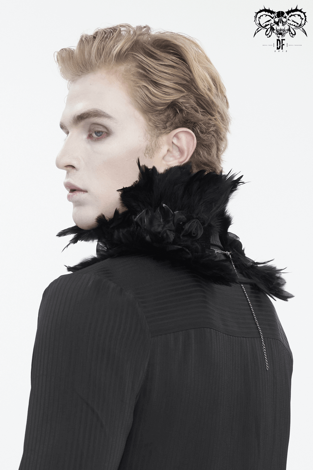 Elegant black collar with feathers and fabric flowers worn by a model, showcasing gothic flair and style.